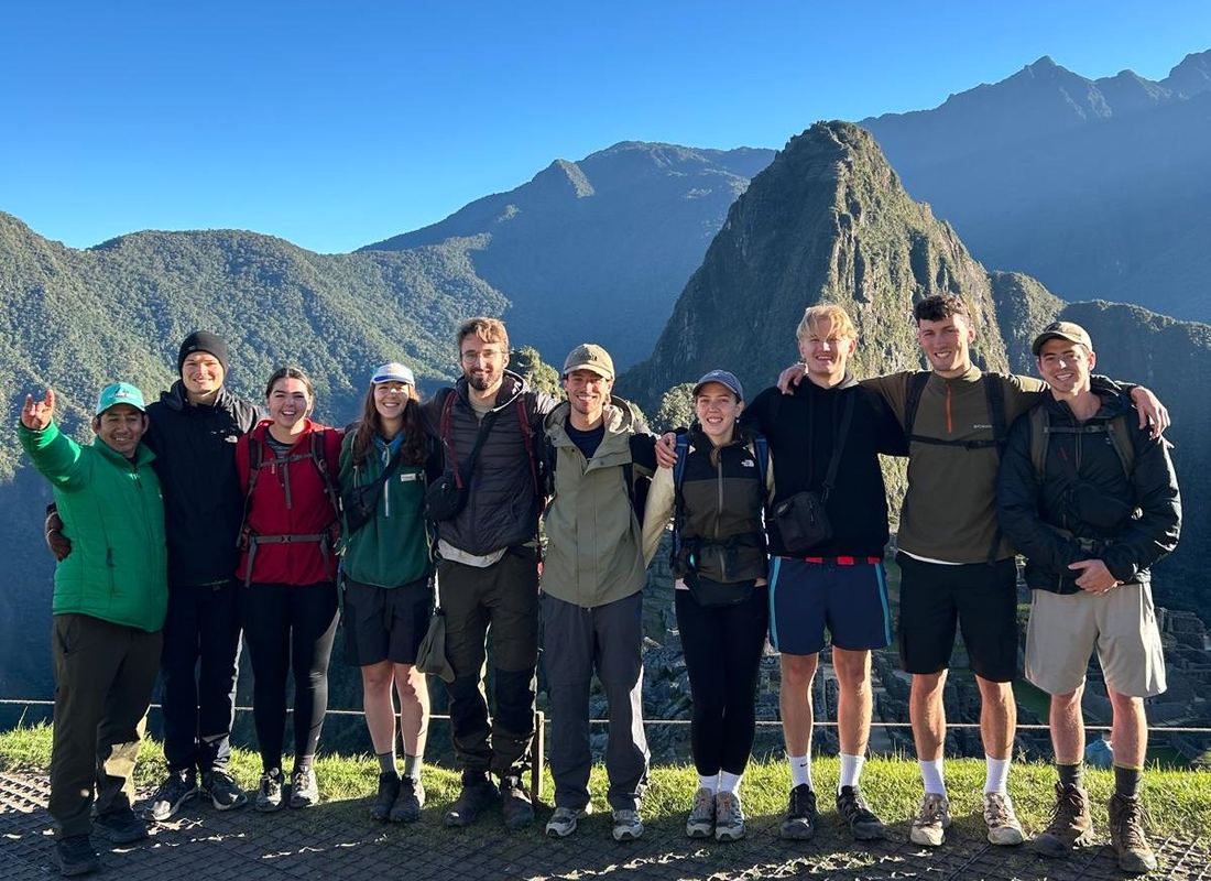 The No Drama Llama Peru team and guide together at Machu Picchu